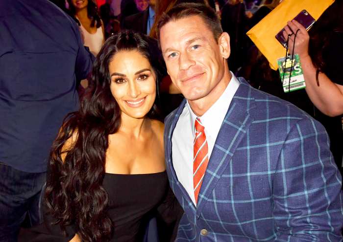 Nikki Bella and John Cena attend the 2017 MTV Movie And TV Awards at The Shrine Auditorium in Los Angeles, California.