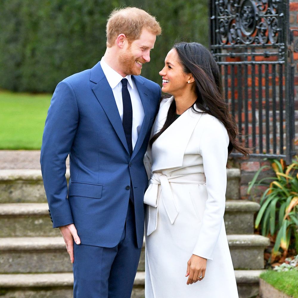 Prince Harry and Meghan Markle during an official photocall to announce their engagement at The Sunken Gardens at Kensington Palace on November 27, 2017 in London, England.