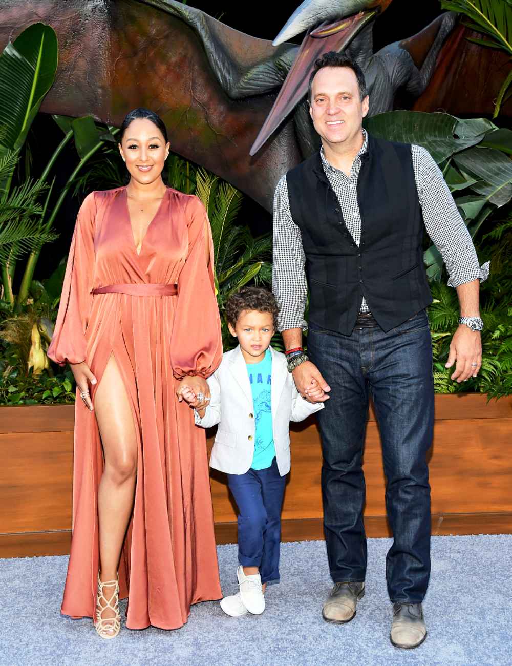 Tamera Mowry and Adam Housley with son Aden attend the premiere of 'Jurassic World: Fallen Kingdom' at Walt Disney Concert Hall on June 12, 2018 in Los Angeles, California.