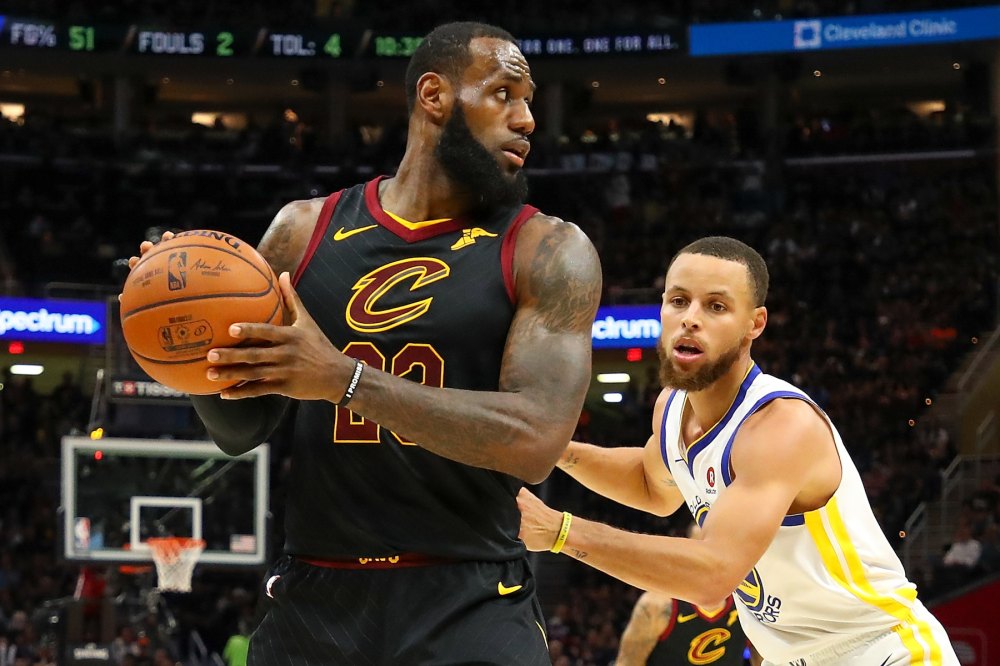 LeBron James #23 of the Cleveland Cavaliers defended by Stephen Curry #30 of the Golden State Warriors during Game Four of the 2018 NBA Finals at Quicken Loans Arena on June 8, 2018 in Cleveland, Ohio.