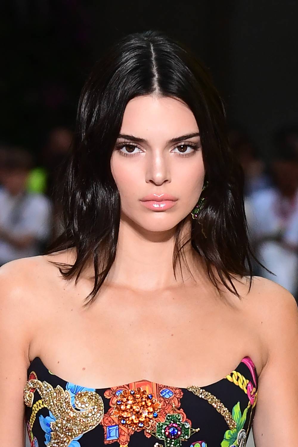 US model Kendall Jenner presents a creation by Versace during the men & women's spring/summer 2019 collection fashion show in Milan, on June 16, 2018. (Photo by MIGUEL MEDINA / AFP) (Photo credit should read MIGUEL MEDINA/AFP/Getty Images)