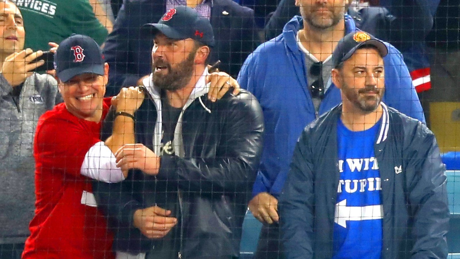 Jimmy Kimmel (R) looks on as Matt Damon and Ben Affleck celebrate the Boston Red Sox winning the World Series v The Los Angeles Dodgers.
