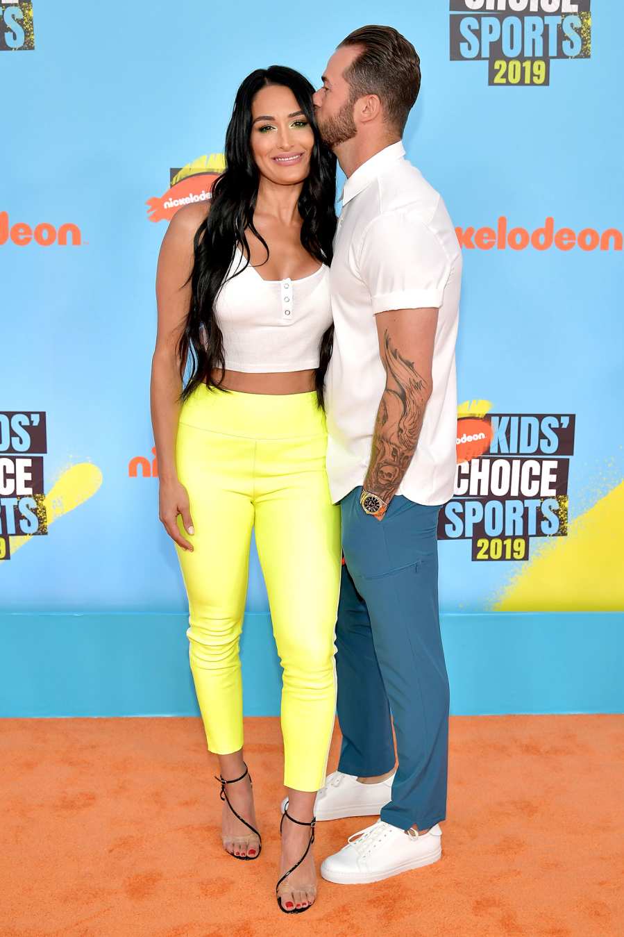 Nikki Bella and Artem Chigvintsev Red Orange Carpet Nickelodeon Kids' Choice Sports 2019