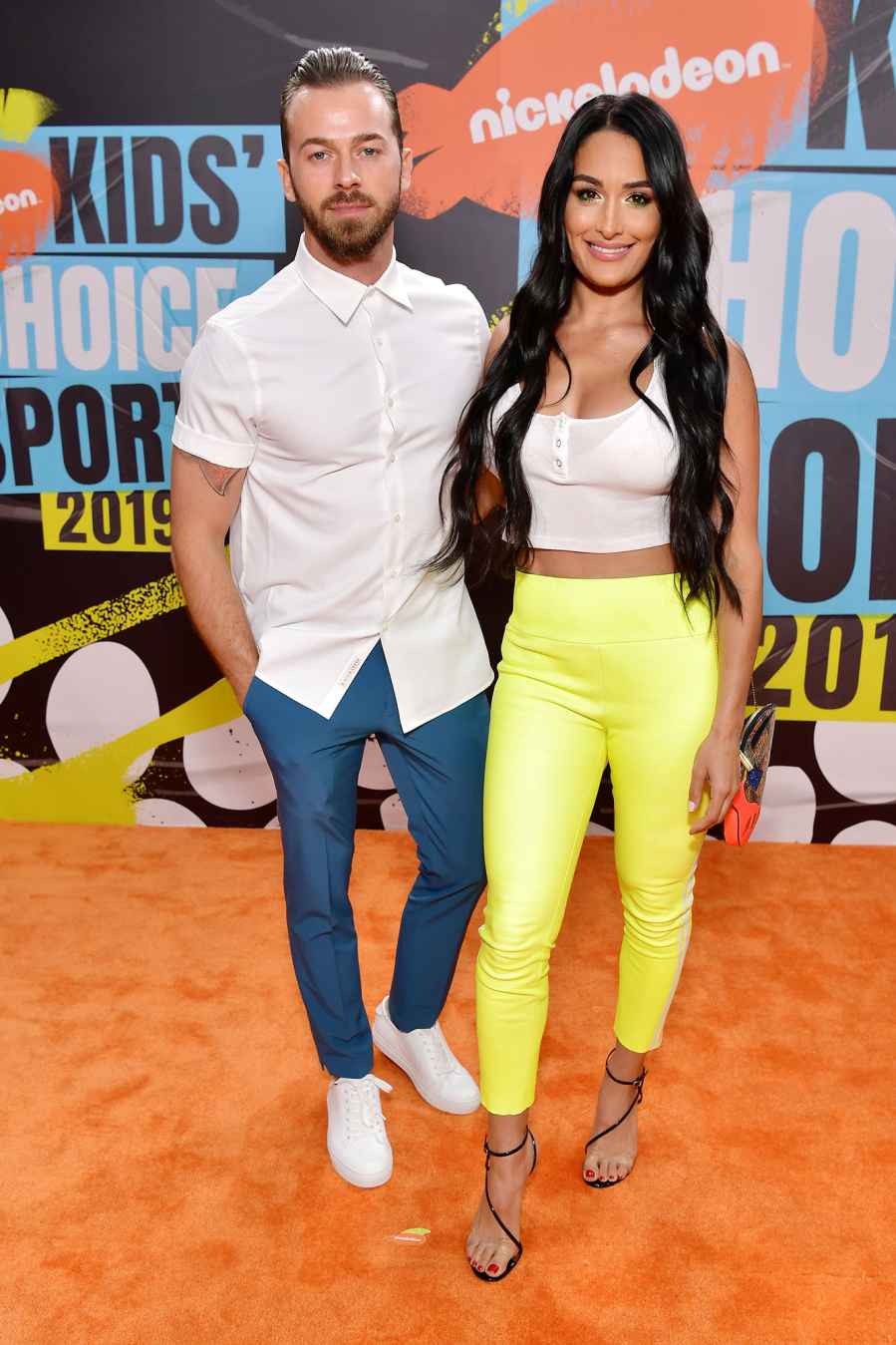 Nikki Bella and Artem Chigvintsev Red Orange Carpet Nickelodeon Kids' Choice Sports 2019