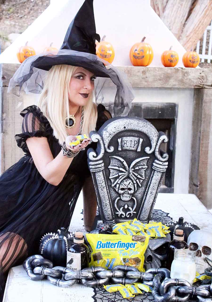 Tori Spelling Dressed as a Witch for Halloween with Butterfinger Candy
