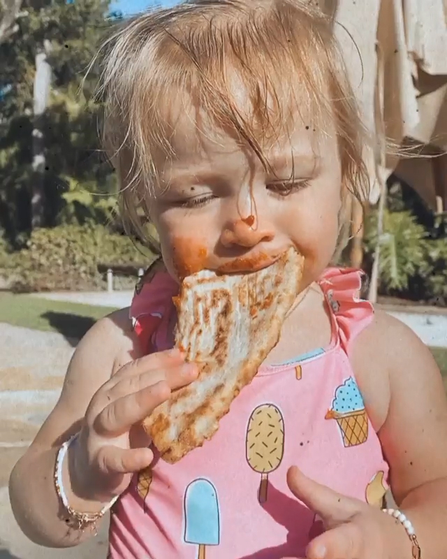 Hilary Duff's Daughter Banks Adorably Devours a Slice of Pizza: 'Take Notes'