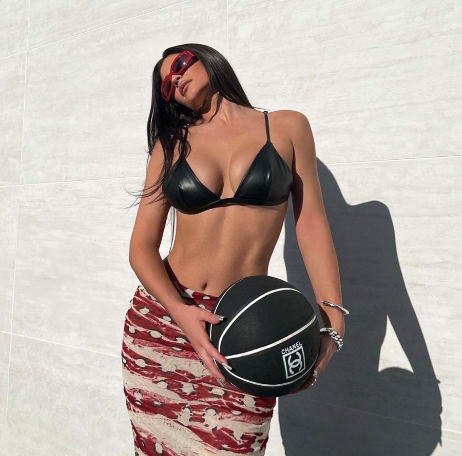 Kylie Jenner Shows Off Washboard Abs in Skimpy Latex Bikini
