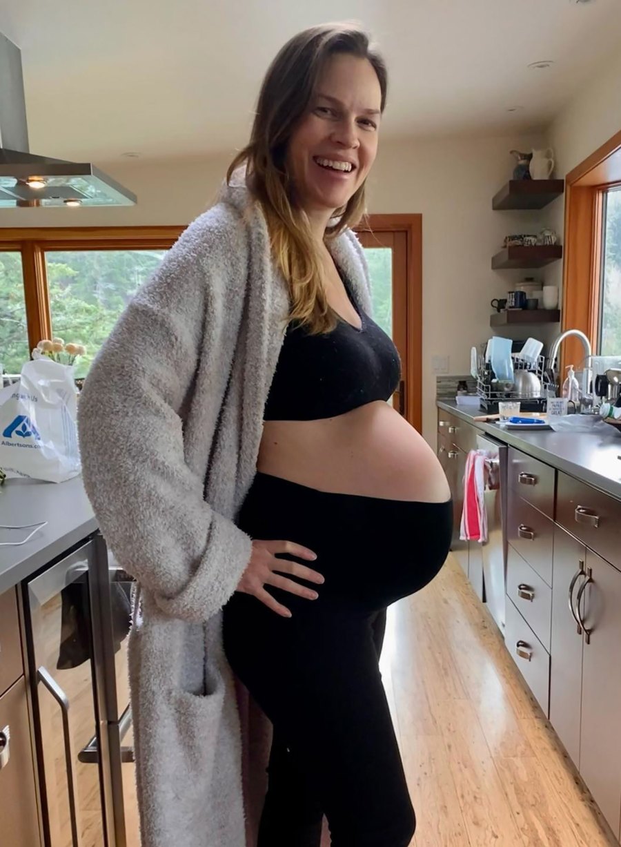 Hilary Swank Shows Off Baby Bump After Announcing She’s Expecting Twins With Husband Philip Schneider black sports bra