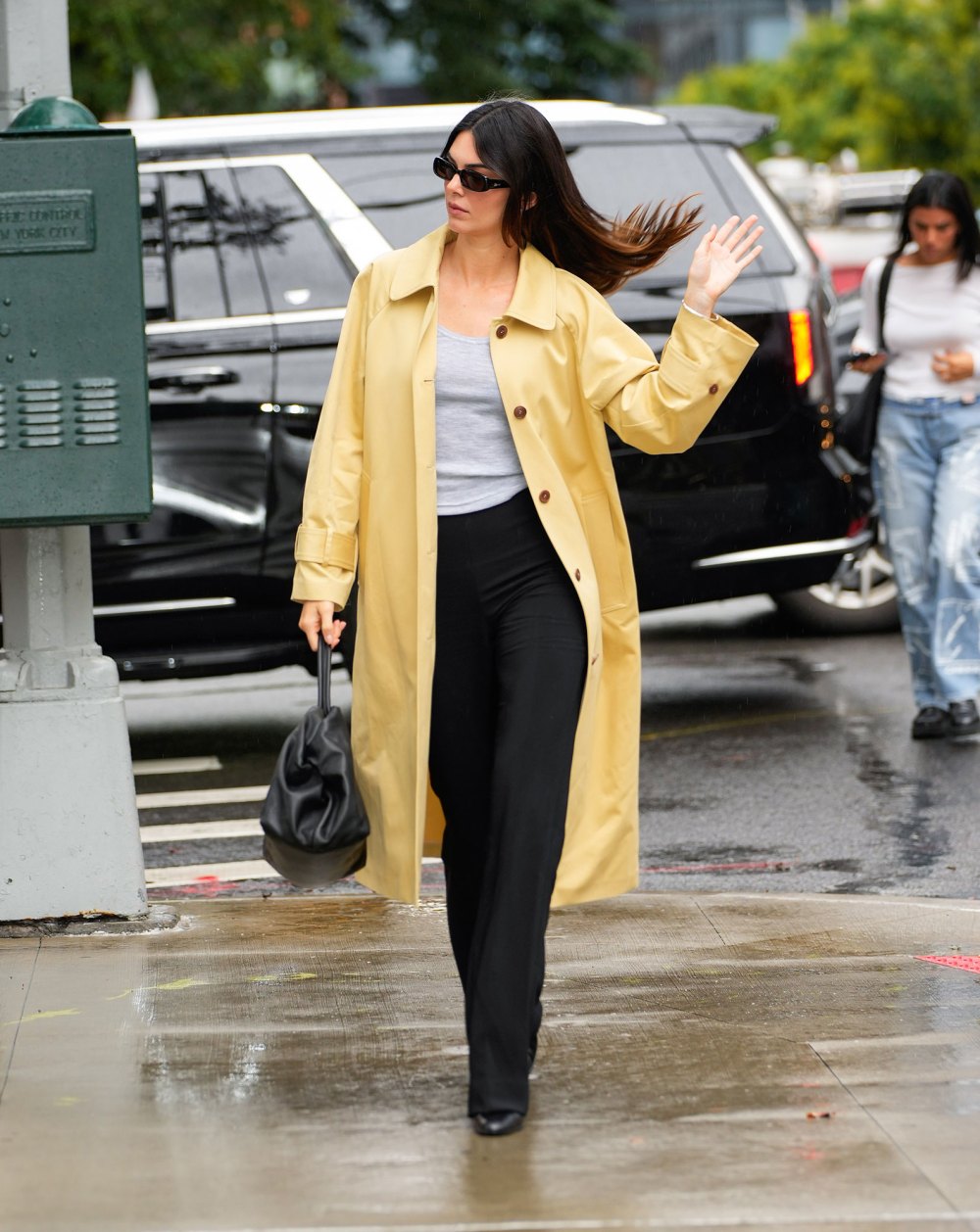 Kendall Jenner Brings Sunshine to a Rainy Day in Chic Yellow Coat