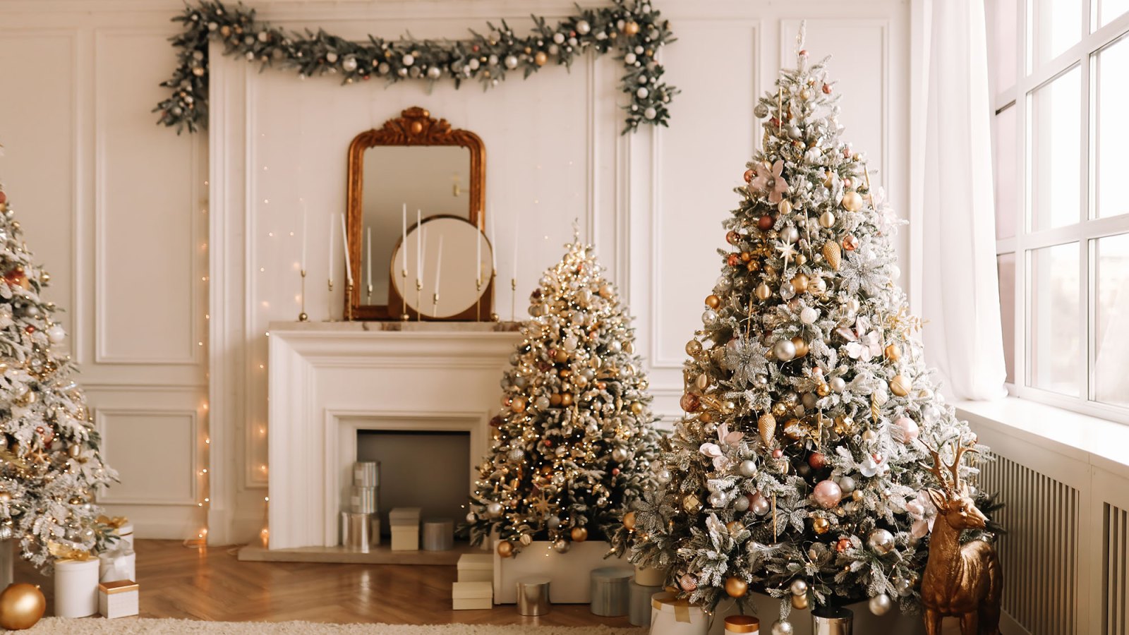 Christmas concept. Festive Christmas rich interior in a luxurious modern style with a fireplace and decorated with Christmas balls and garlands of Christmas trees in a large bright living room in the apartment on New Year's Eve in winter.