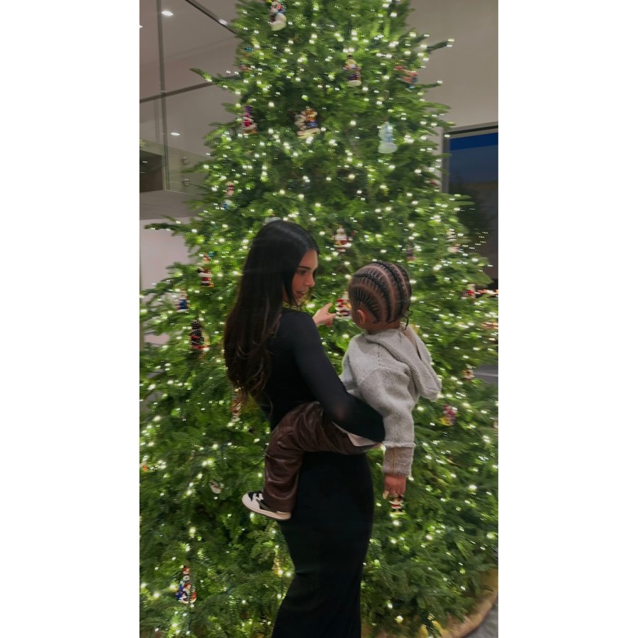 Kendall Jenner Snuggles Sister Kylie s Son Aire in Front of Christmas Tree