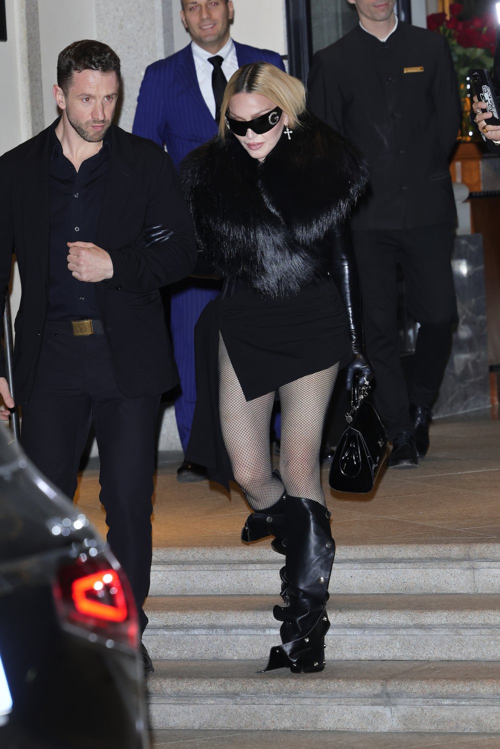 Madonna Steps Out in Fishnet Tights and Slouchy Boots in Milan After Celebration Tour Show
