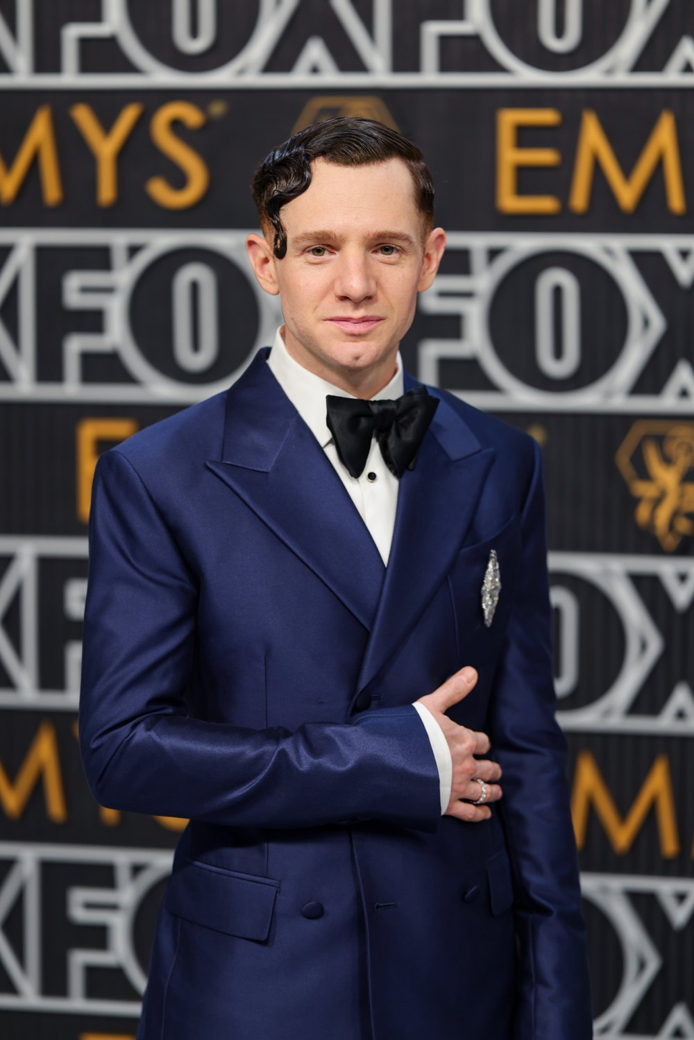 Chris Perfetti Sports Artfully Gelled Hair and a Sharp Navy Suit at the 2023 Emmys