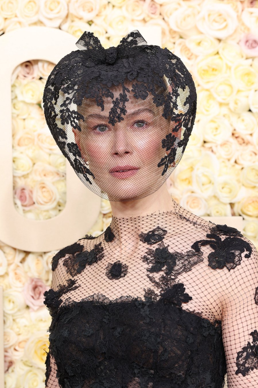 Rosamund Pike Wears Dior Veil at 2024 Golden Globes After Ski Accident