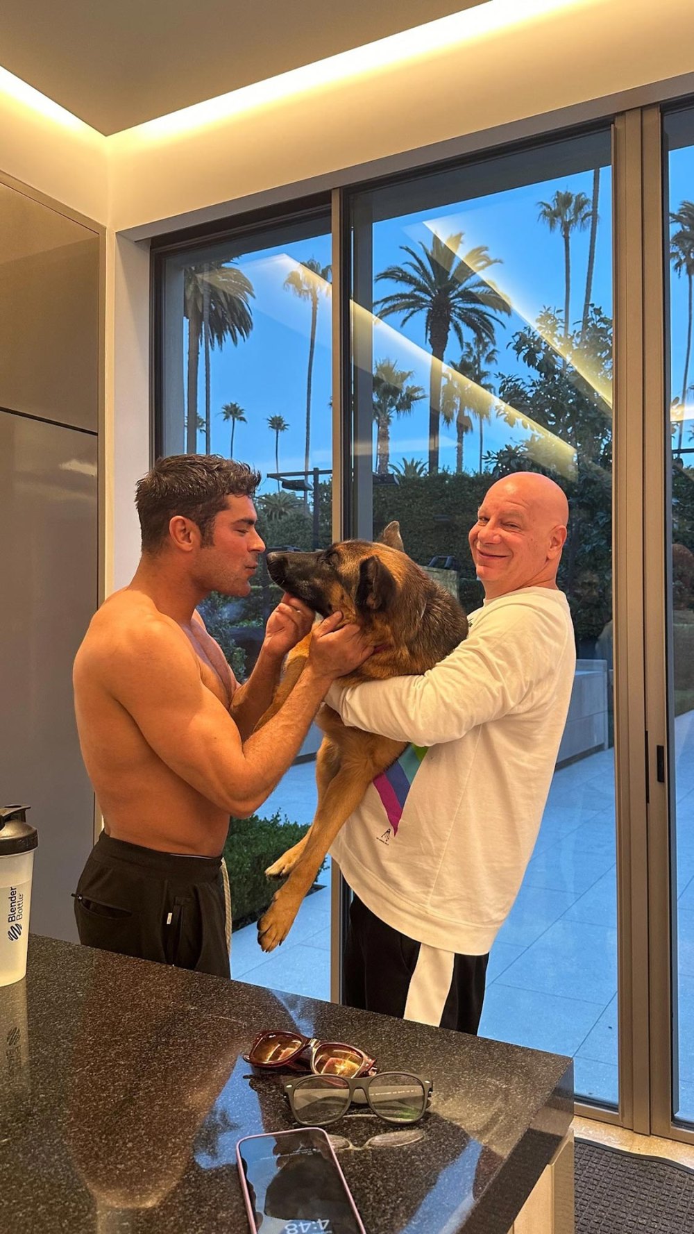 Shirtless Zac Efron Cuddling a Dog Is Exactly What You Need to See to Ward Off Sunday Scaries