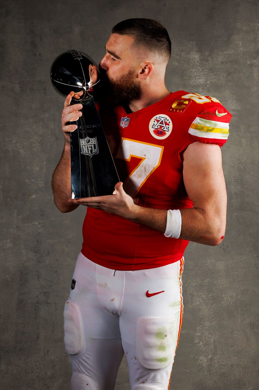 Travis Kelce Kansas City Chiefs Players Kiss Vince Lombardi Trophy in Super Bowl LVIII Winners Portraits