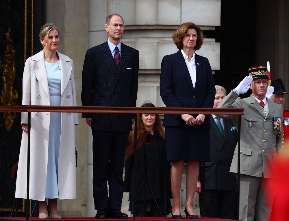 Sophie, Duchess of Edinburgh (L) and Prince Edward, Duke of Edinburgh (C) on behalf of King Charles III, stand with French Ambassador to the UK, Helene Duchene (2nd R) as they watch the Changing of the Guard at Buckingham Palace with France's Gendarmerie's Garde Republicaine taking part to comme