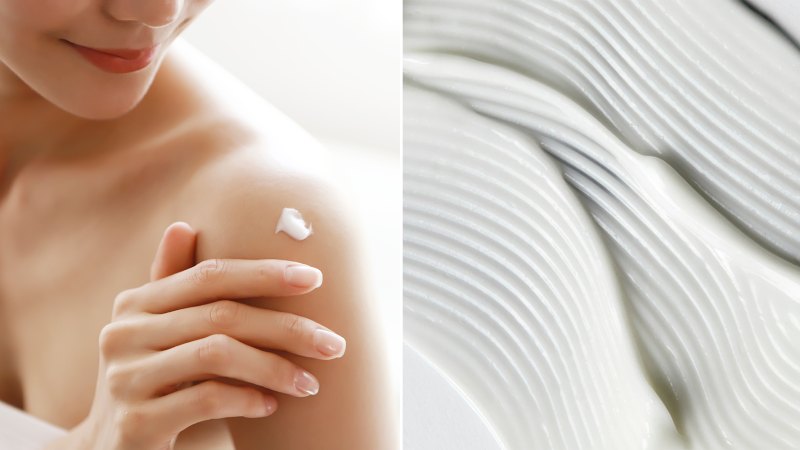 woman applying body lotion on shoulder