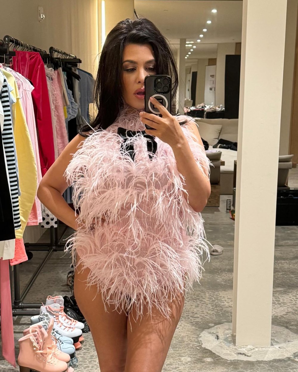 Kourtney Kardashian Delivers Drama in Feathered Pink Bodysuit