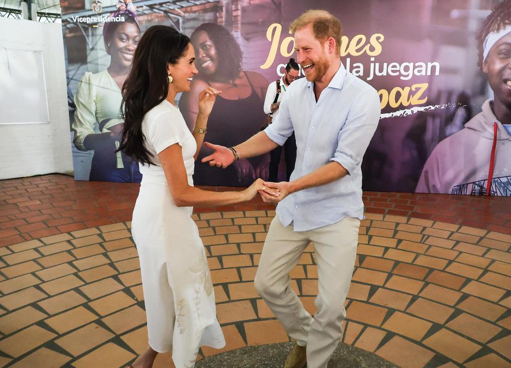 Prince Harry and Meghan Markle Share a Kiss Salsa 2