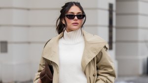 BERLIN, GERMANY - FEBRUARY 01: Aylin Sengül wears white jeans & beige trench coat Arket, turtleneck Cos, sunglasses YSL, loafers H&M, brown suede bag Demellier London during the Berlin Fashion Week Autumn/Winter 2026 at on February 01, 2026 in Berlin, Germany. (Photo by Christian Vierig/Getty Images)