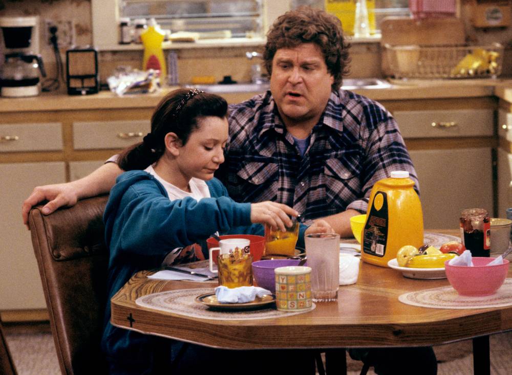 Sara Gilbert and John Goodman on Roseanne in 1989.