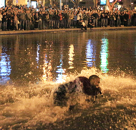 kanye west jumps in lake