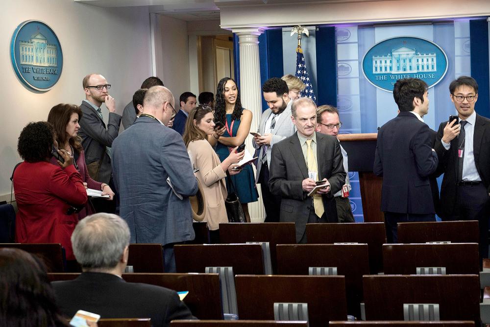 Reporters leave after failing to get access to an off camera briefing with White House Press Secretary Sean Spicer and a small group of reporters instead of the normal on camera briefing at the White House on February 24, 2017 in Washington, DC.