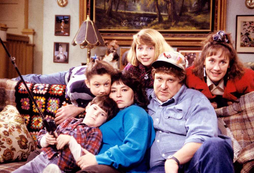 Michael Fishman, Sara Gilbert, Roseanne Barr, Alicia Goranson, John Goodman, and Laurie Metcalf on Roseanne.